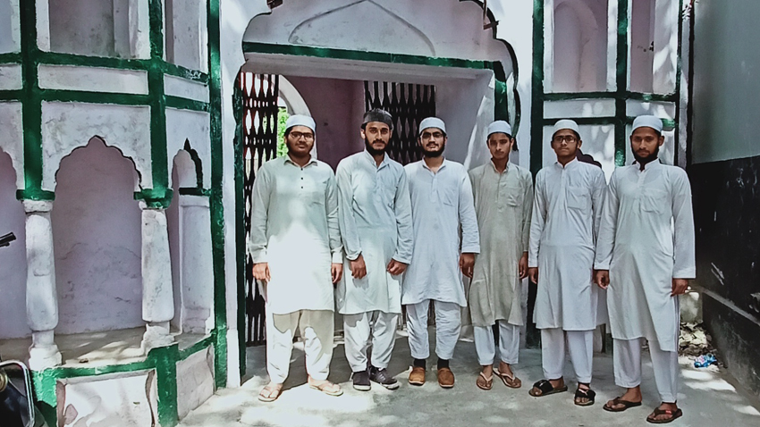 Students standing at a campus entrance