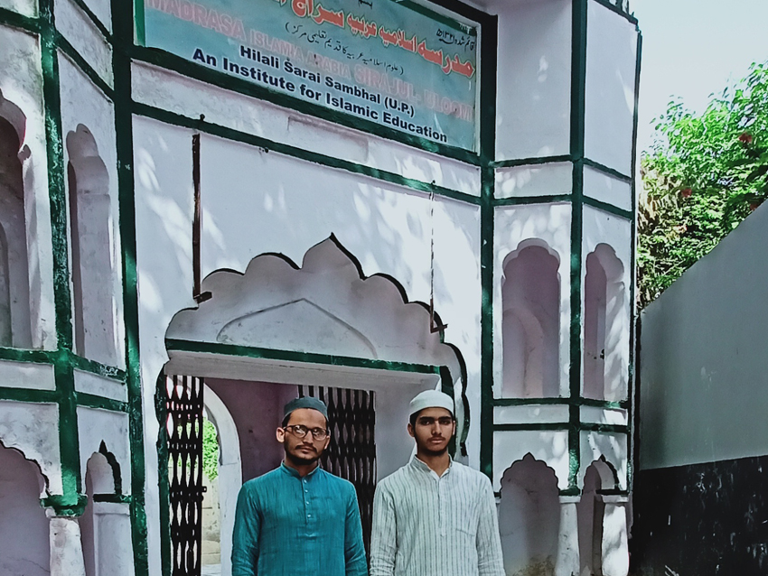 Students at the Siraj-ul-Uloom entrance
