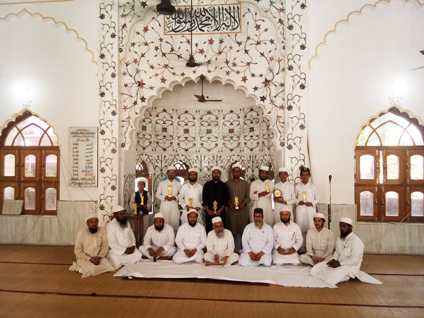 Students and teachers gathered inside the madrasa